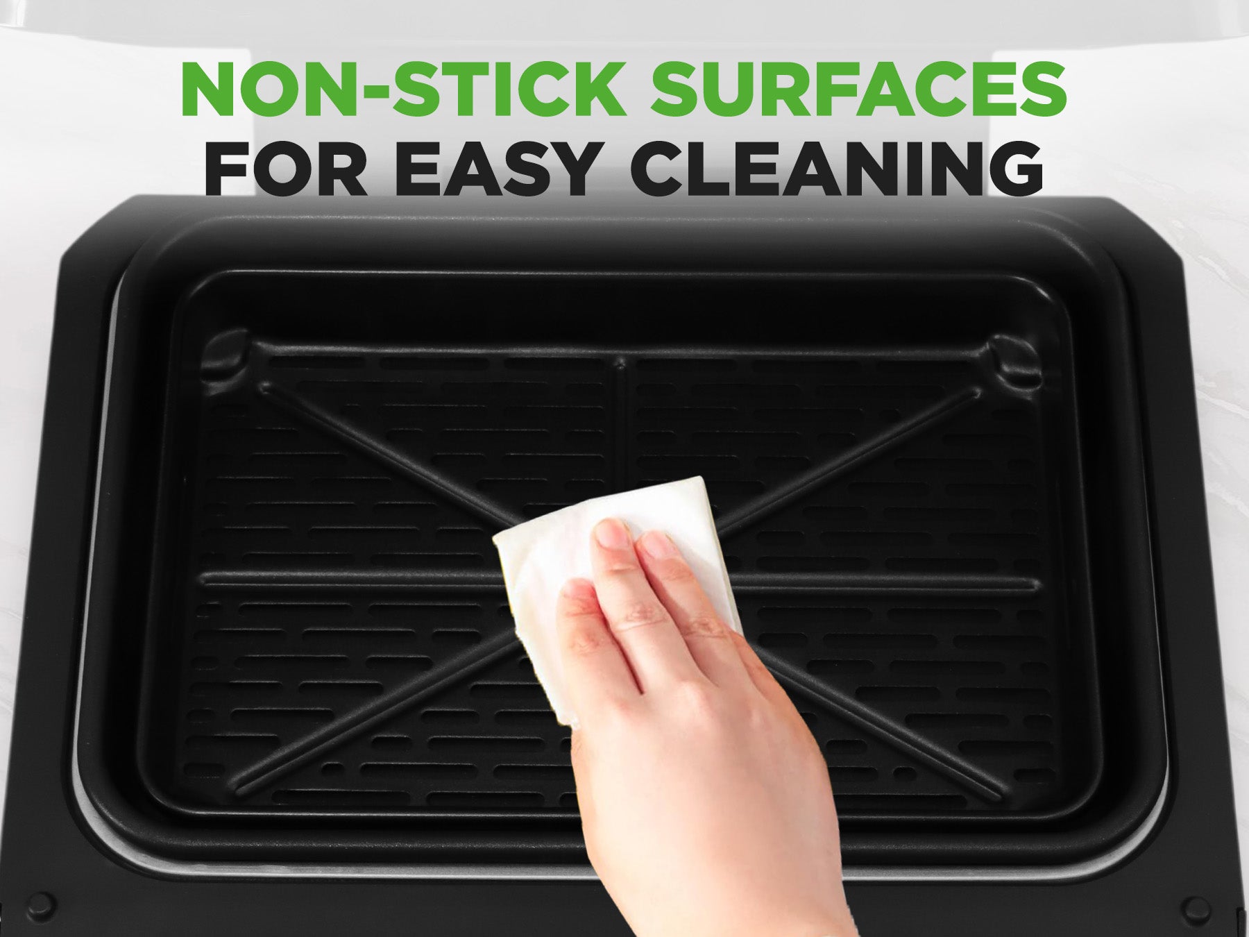 Person cleaning a black non-stick surface with text 'Non-Stick Surfaces for Easy Cleaning'.