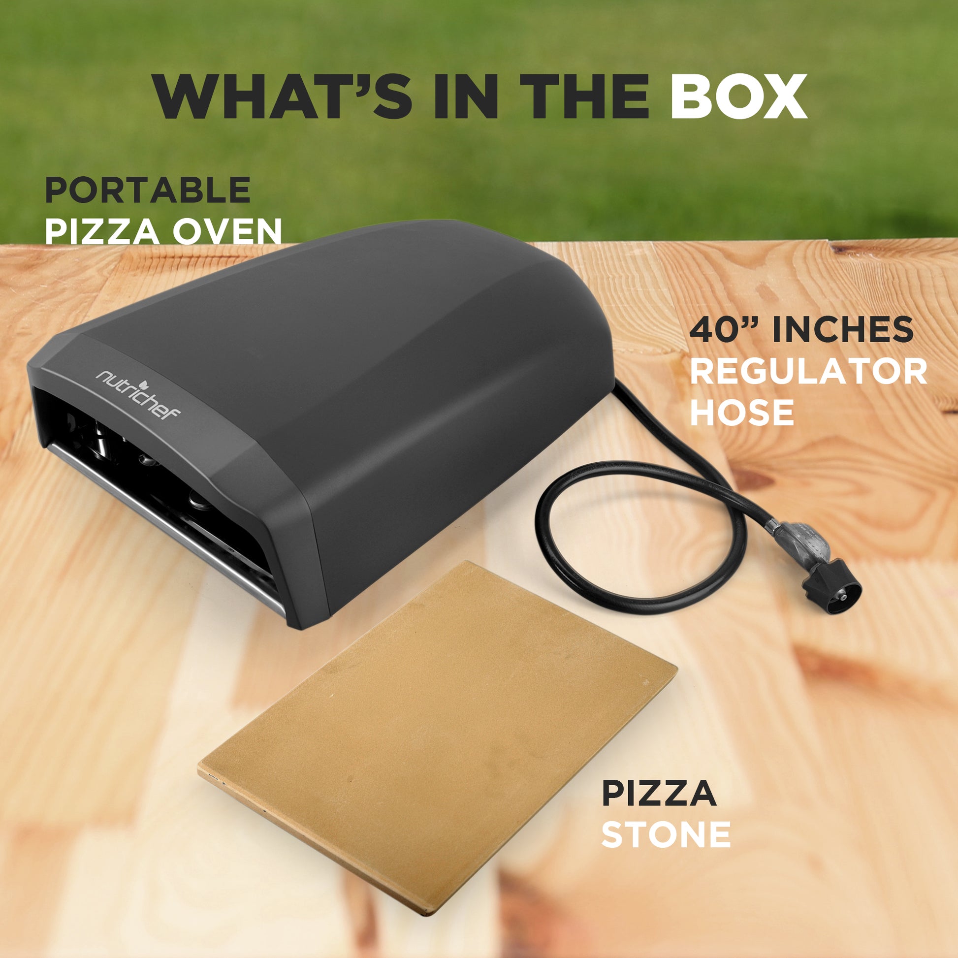 Portable pizza oven kit with regulator hose and pizza stone on a wooden surface.