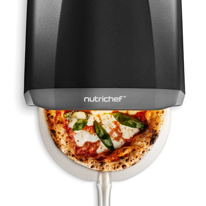 Nutrichef pizza maker with a cooked pizza inside on a white background