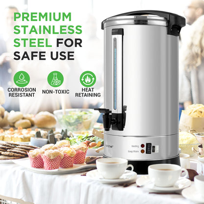 Stainless steel coffee urn with food and drinks in the background, emphasizing safety features.
