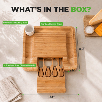 Bamboo cheese board set with utensils and seasoning bowl on a marble surface